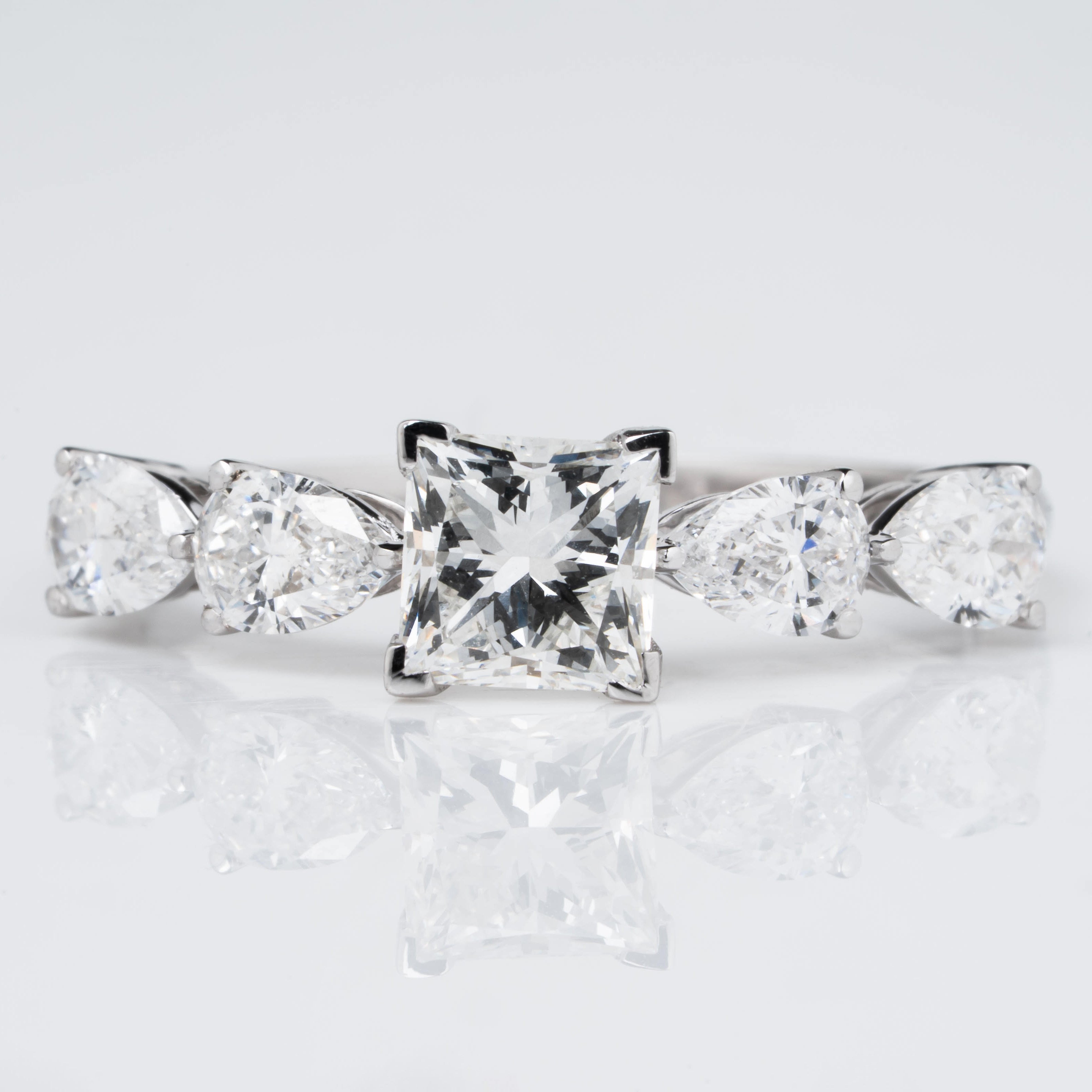 PRINCESS CROWN RING EMBRACED BY PEAR CUT SOLITAIRE LAB GROWN DIAMOND