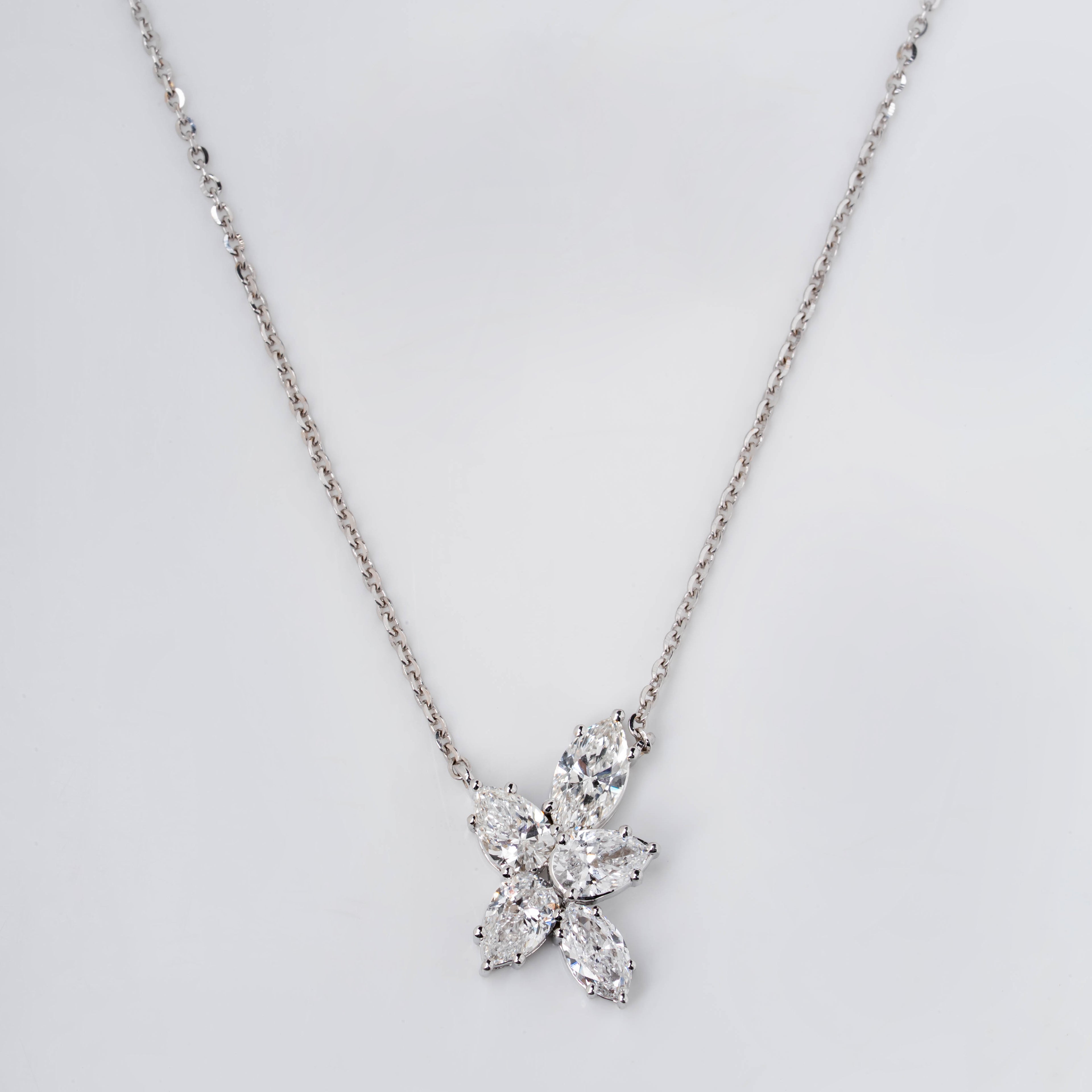 PEAR AND MARQUISE CUT DIAMOND NECKLACE IN VICTORY FLOWER PENDENT
