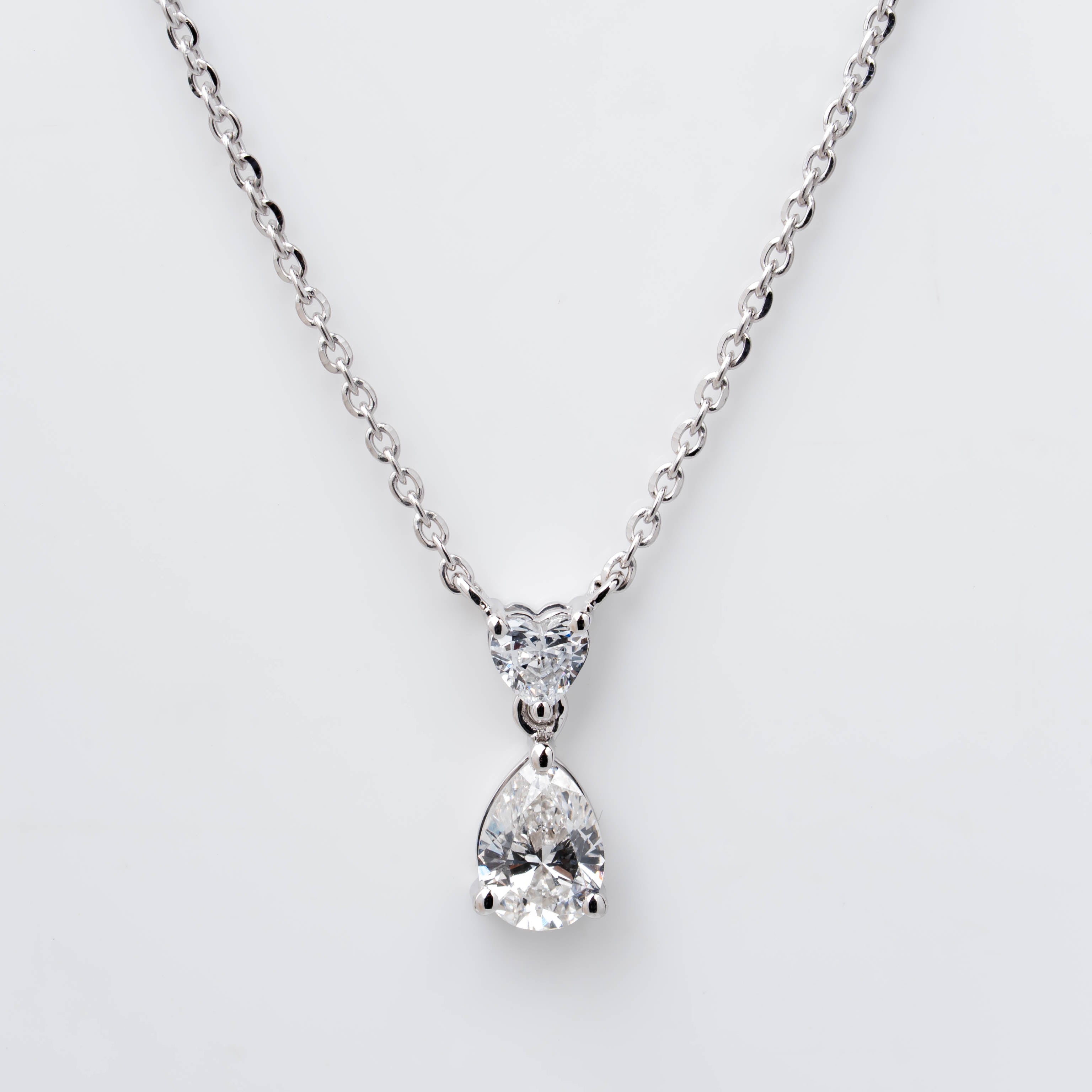 TWO STONE PENDENT EMBRACING PERFECT PEAR CUT SOLITAIR LAB GROWN DIAMOND