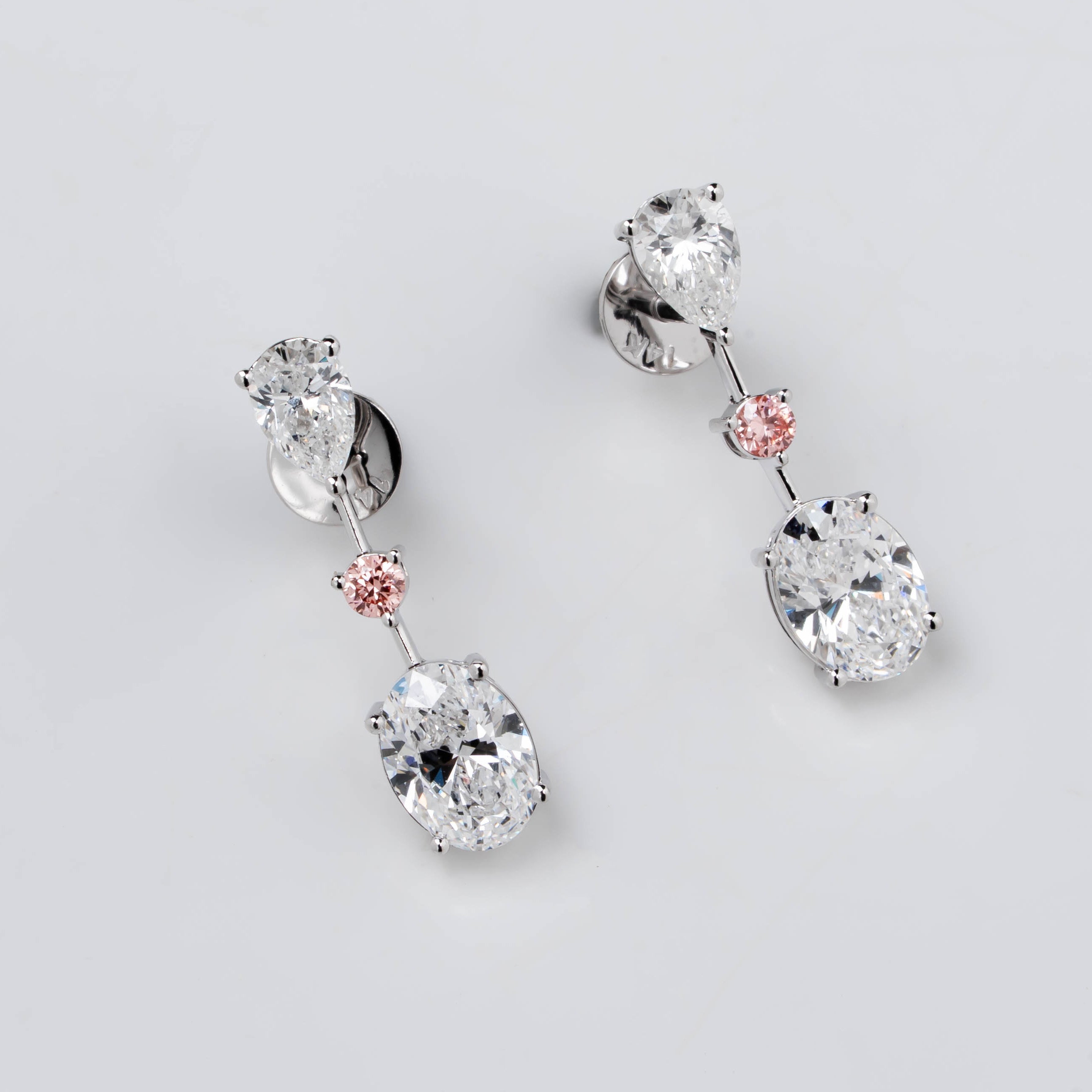 DROP EARRINGS WITH COMBINATION OF PEAR, PINK ROUND & OVAL CUT SOLITAIRE DIAMOND  IN GOLD