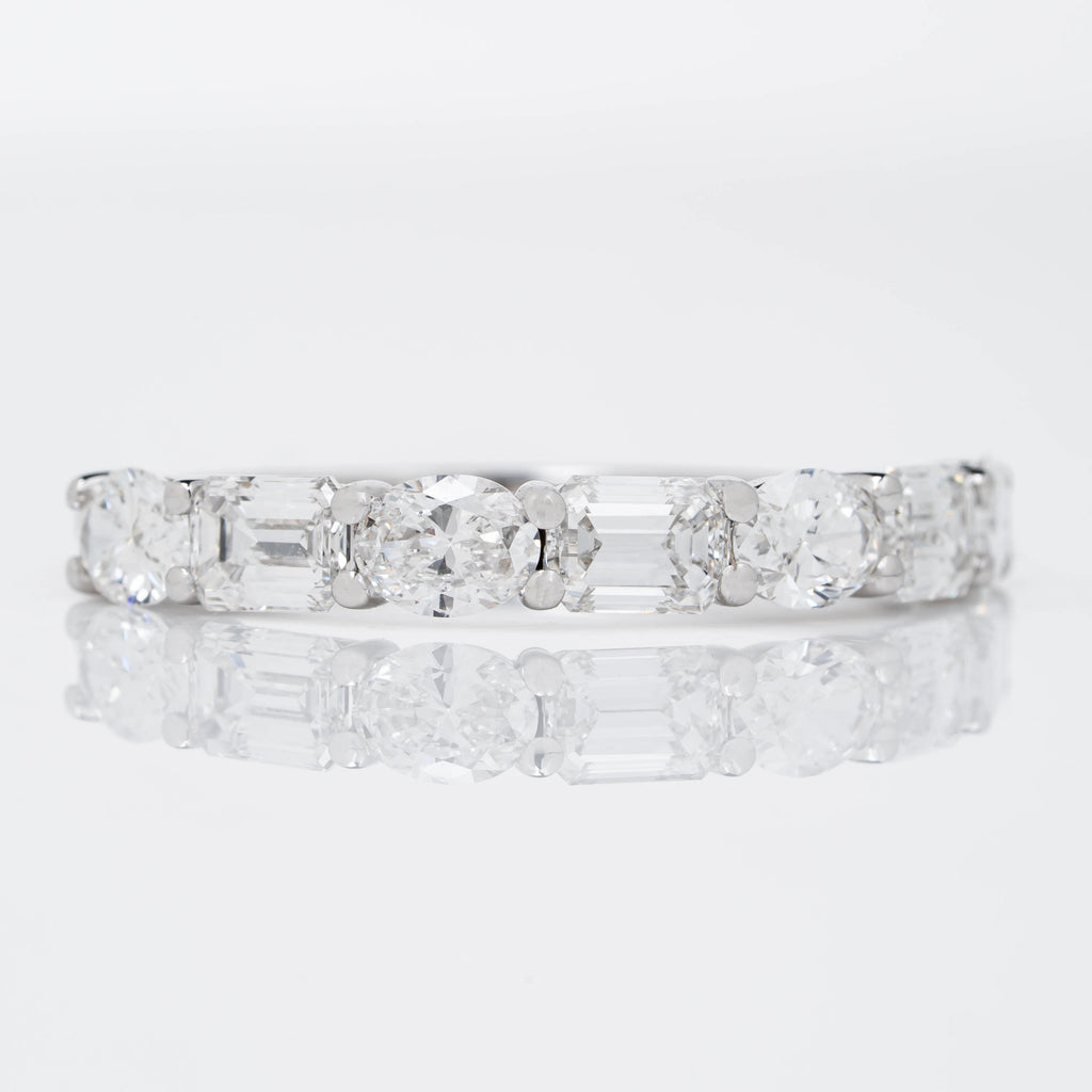EMERALD CROWN RING EMBRACED BY OVAL CUT SOLITAIRE LAB GROWN DIAMOND