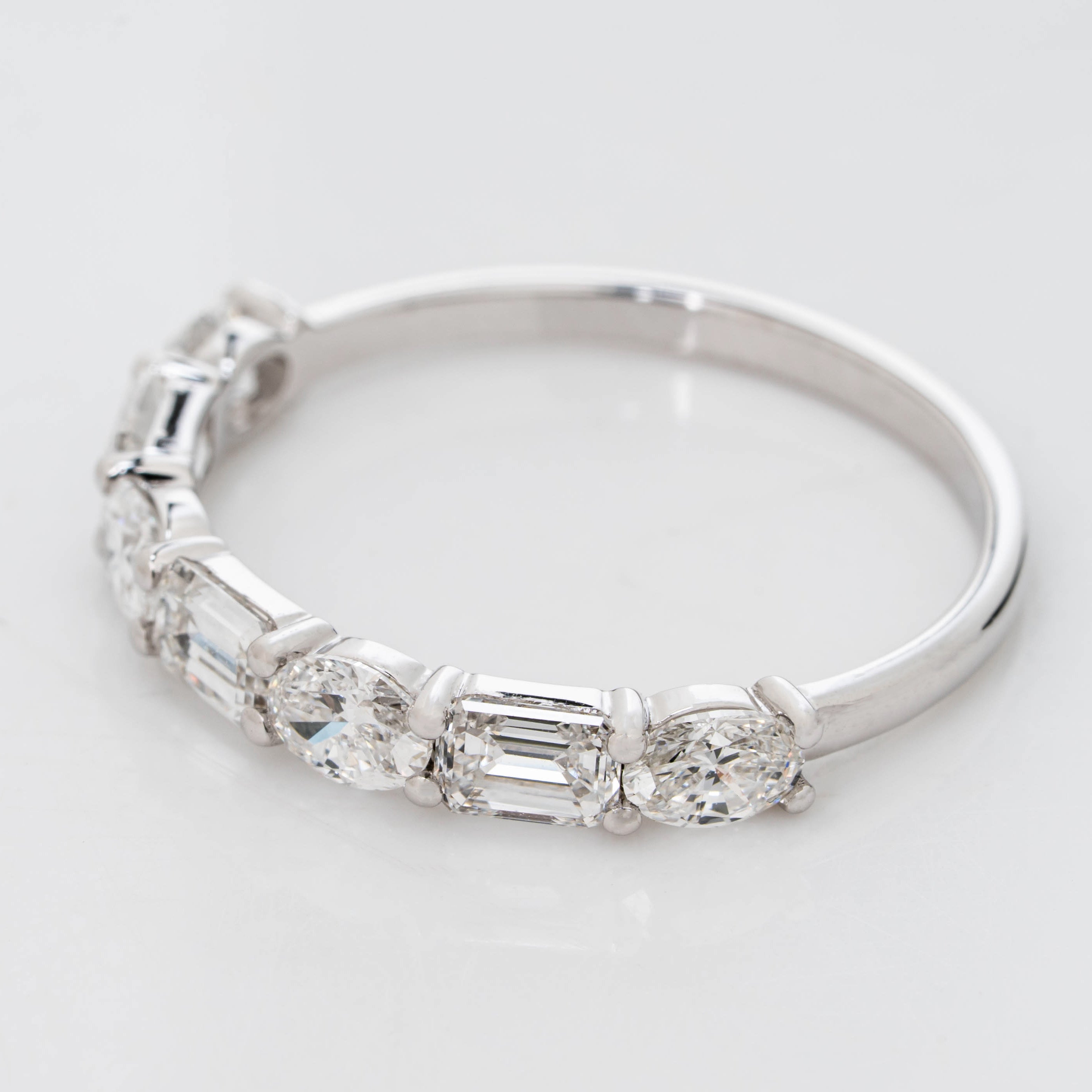 EMERALD CROWN RING EMBRACED BY OVAL CUT SOLITAIRE LAB GROWN DIAMOND