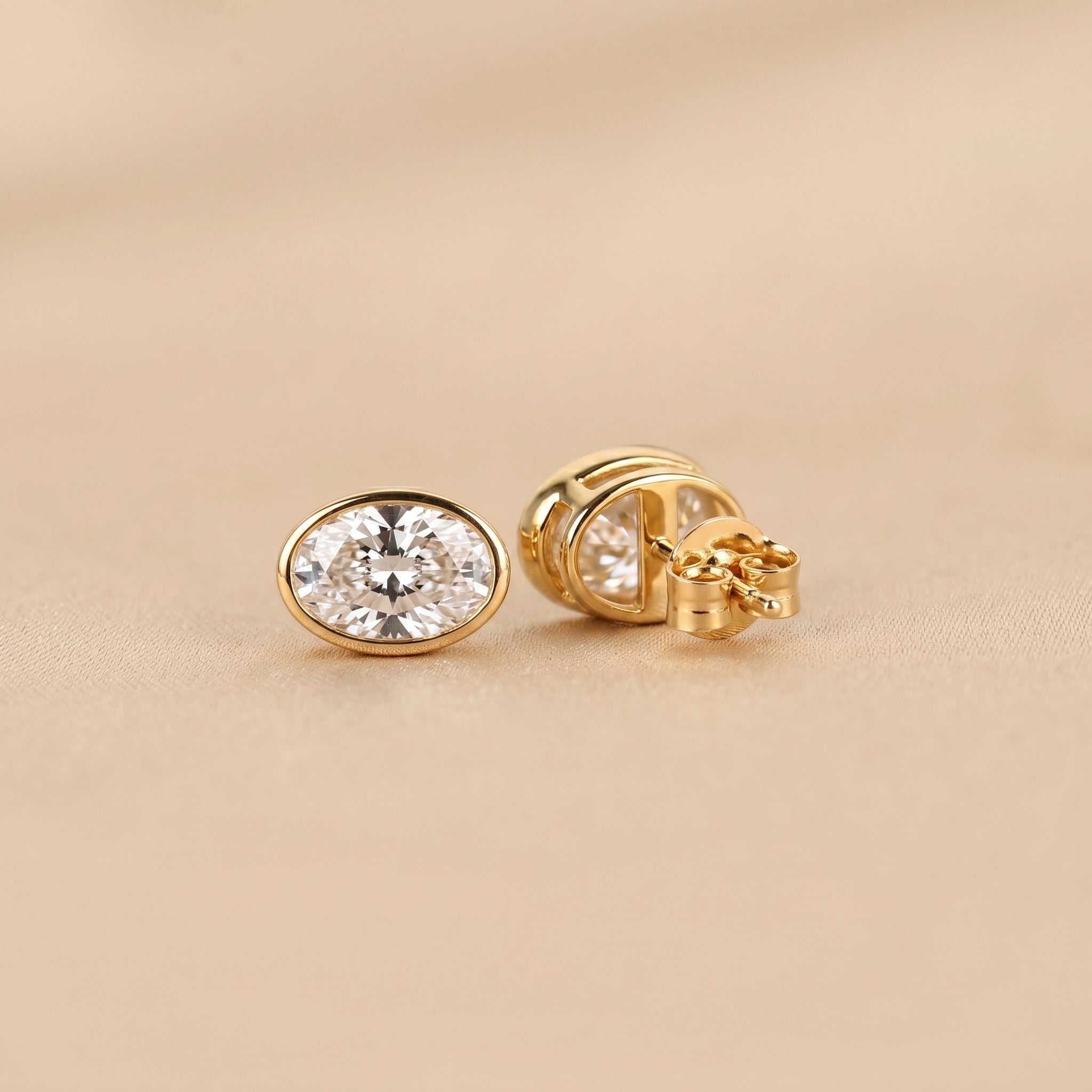 Bezel Set Oval Lab Grown Diamond Stud Earrings in 10K Yellow Gold 3 CTW