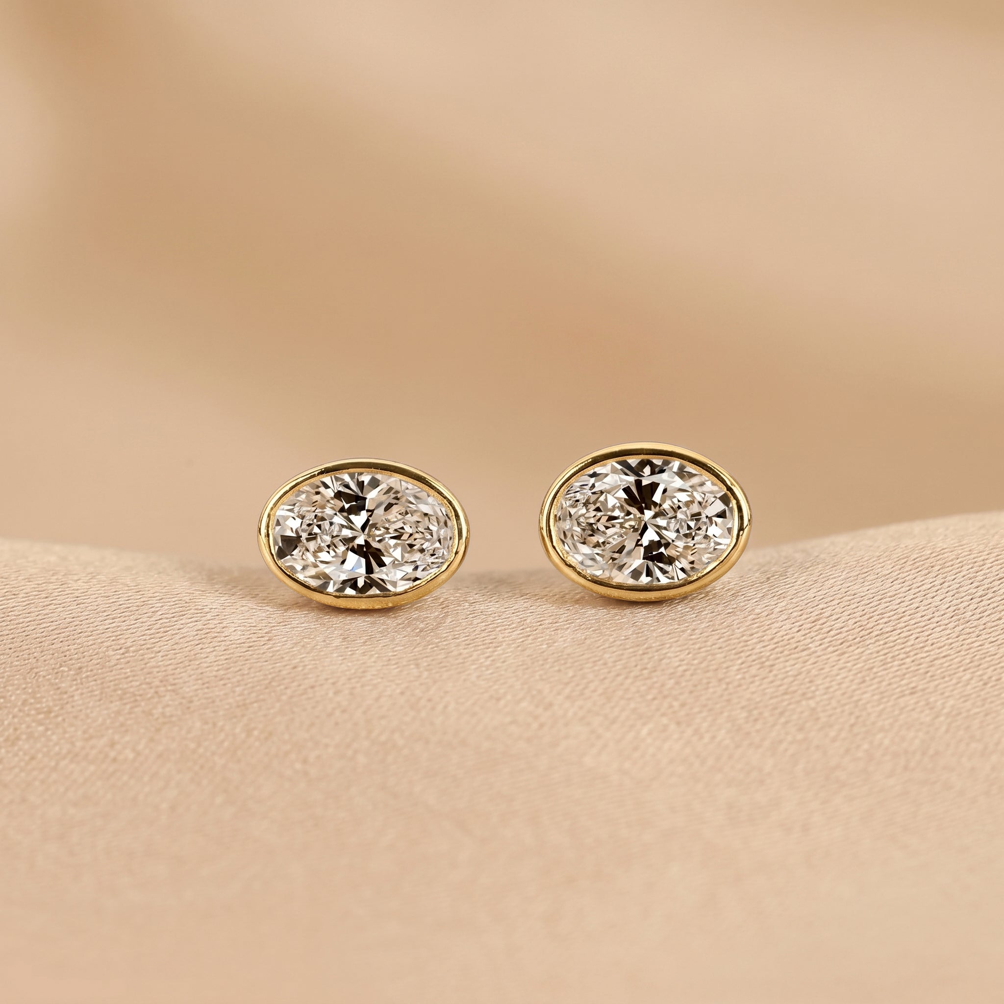 Bezel Set Oval Lab Grown Diamond Stud Earrings in 10K Yellow Gold 3 CTW