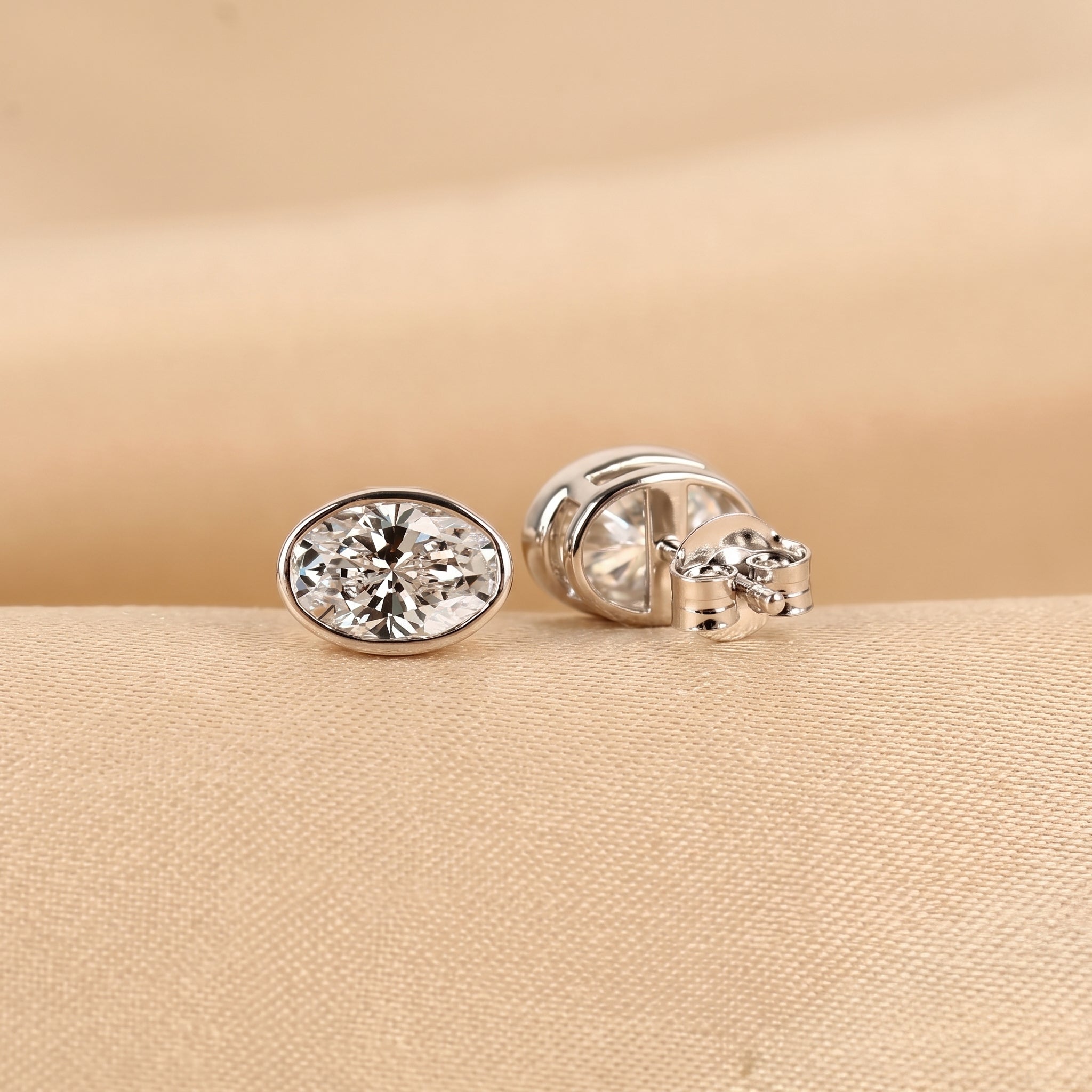 Bezel Set Oval Lab Grown Diamond Stud Earrings in 18K White Gold 3 CTW