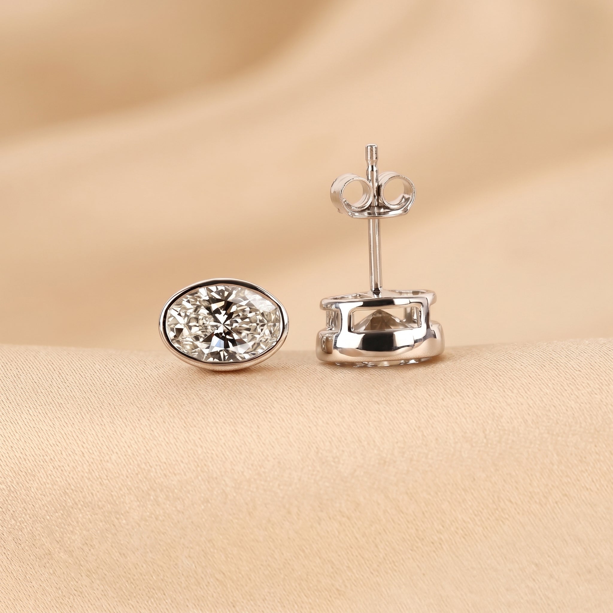 Bezel Set Oval Lab Grown Diamond Stud Earrings in 18K White Gold 3 CTW