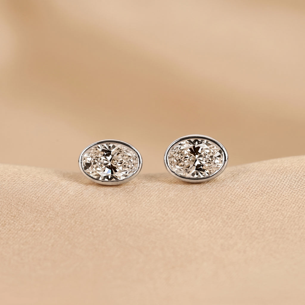 Bezel Set Oval Lab Grown Diamond Stud Earrings in 18K White Gold 3 CTW