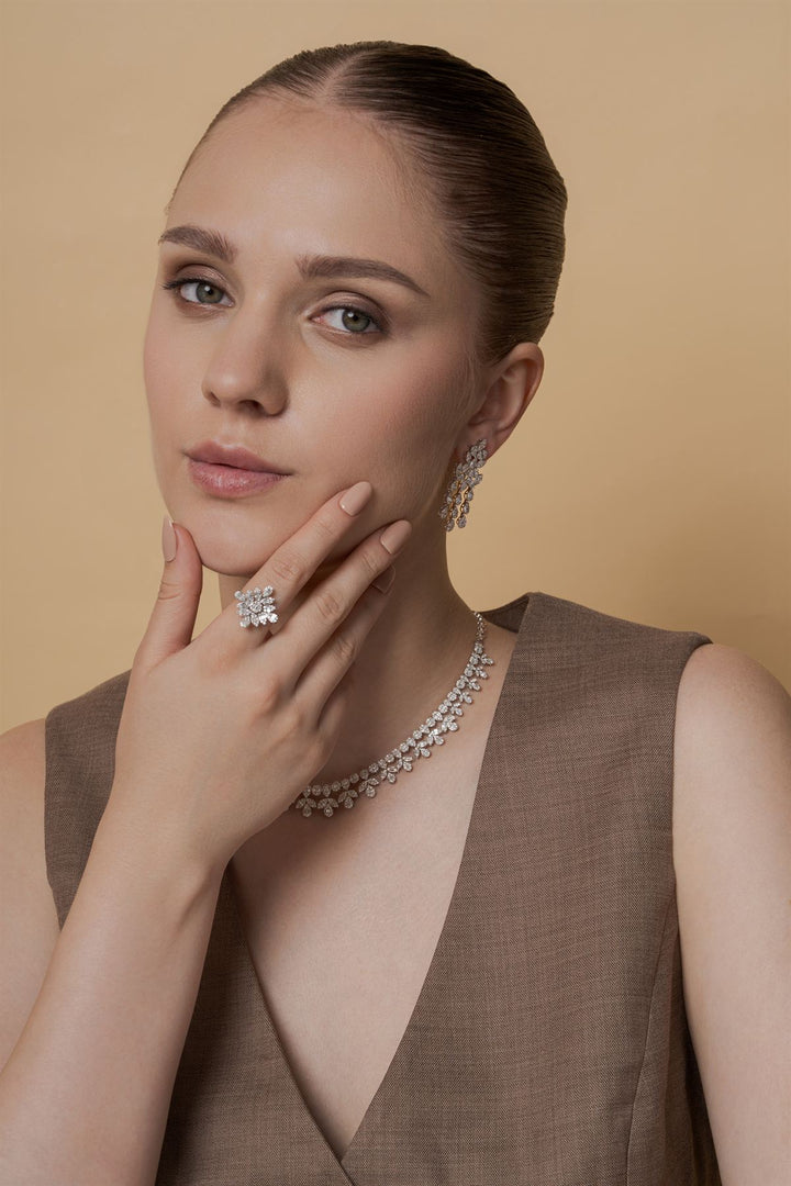 Model wearing a lab-grown diamond ring, necklace and earrings