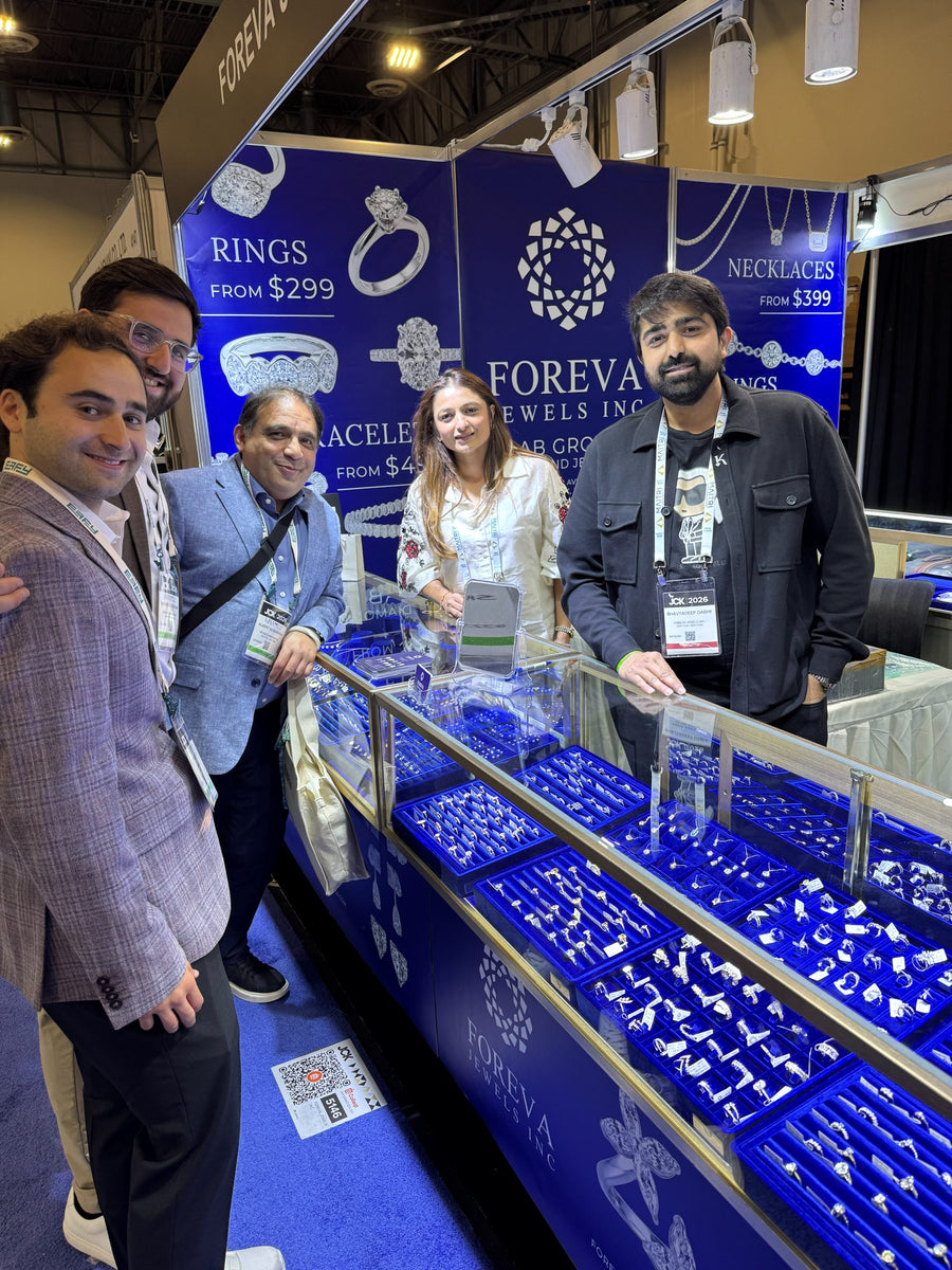 The Foreva Jewels team with visitors behind the display cases at Booth 5146, JCK Las Vegas 2026
