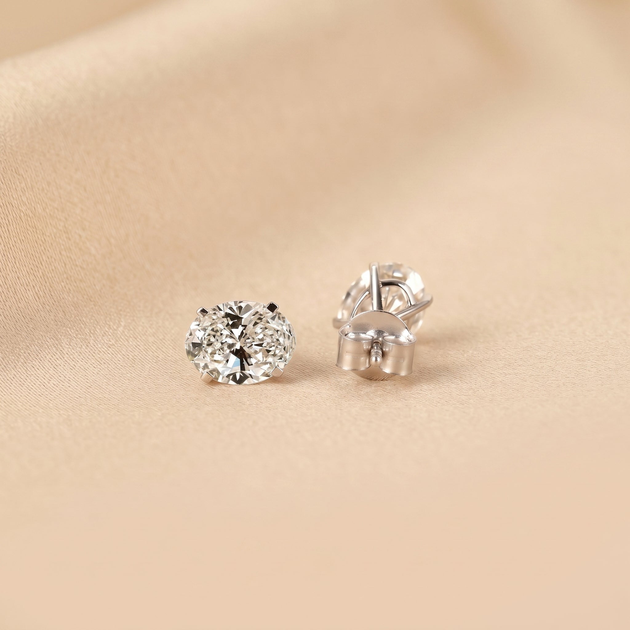 Oval Lab Grown Diamond Stud Earrings in 18K White Gold 3 CTW