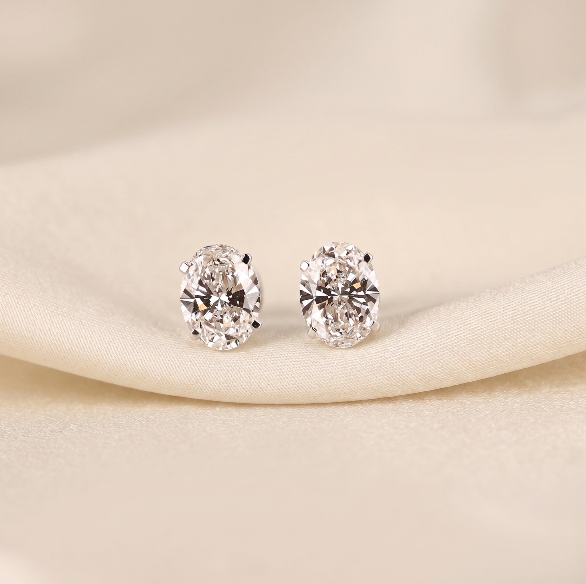 Oval Lab Grown Diamond Stud Earrings in 18K White Gold 3 CTW