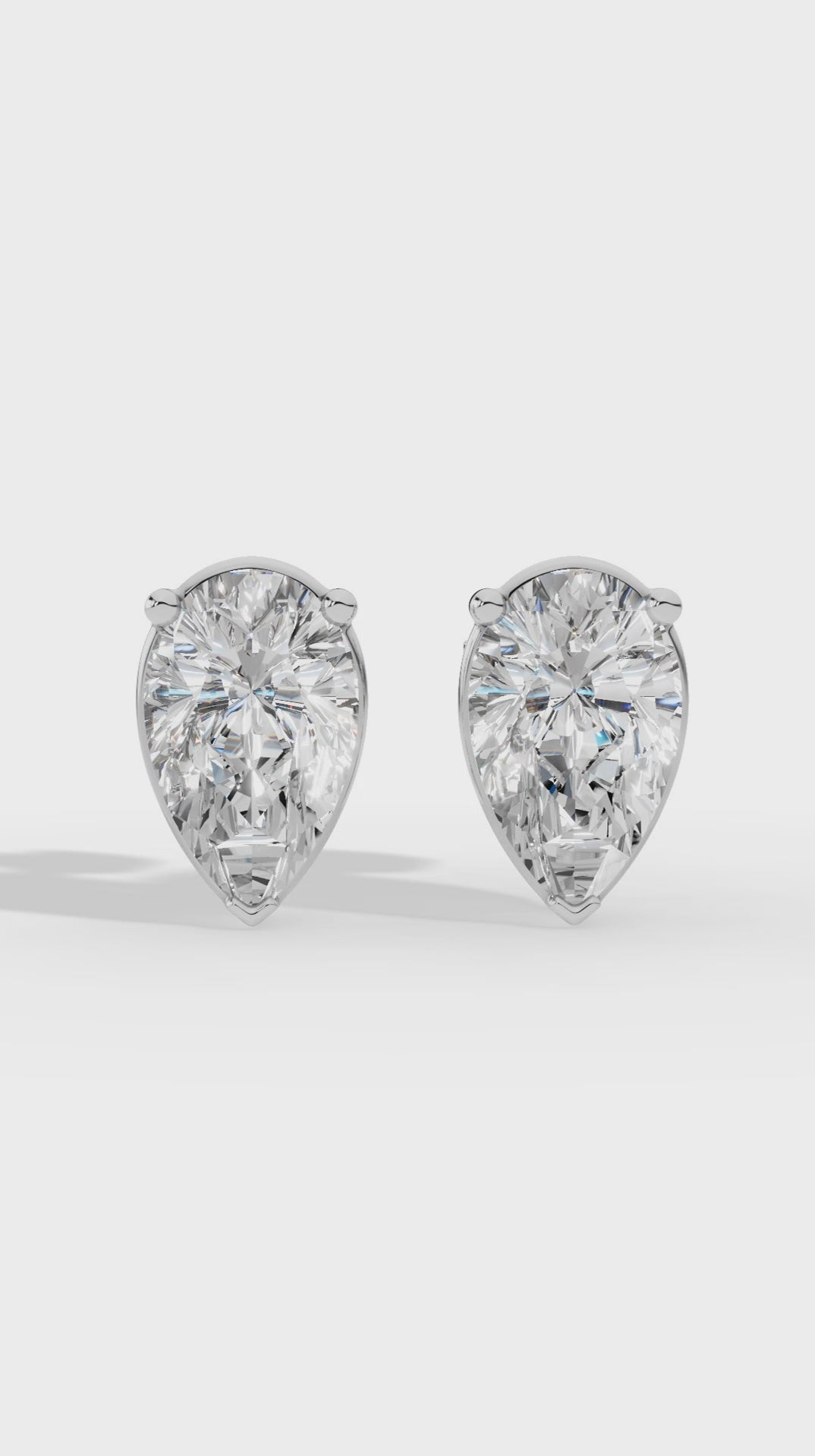 Pear Cut Three Prong  Solitaire Stud Earrings