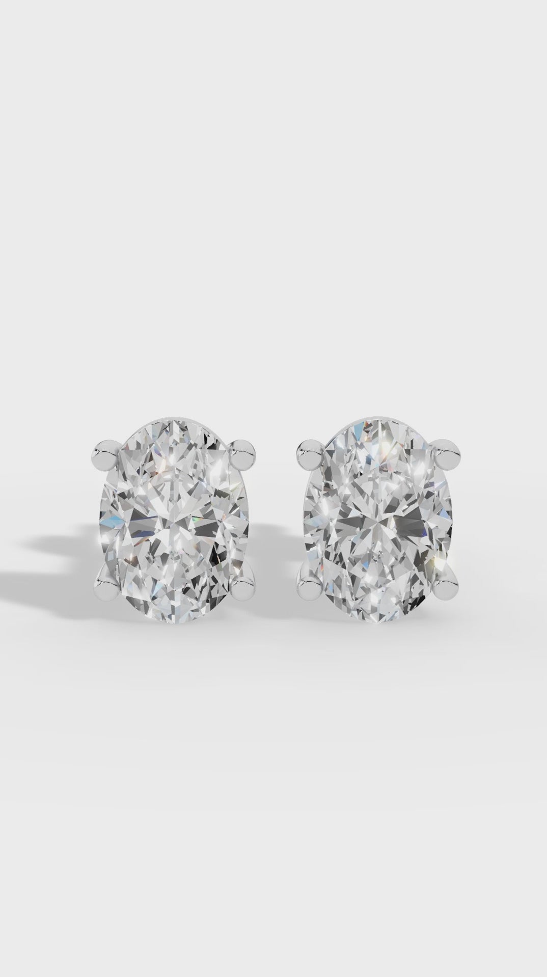 Oval Cut Four Prong Solitaire Stud Earrings
