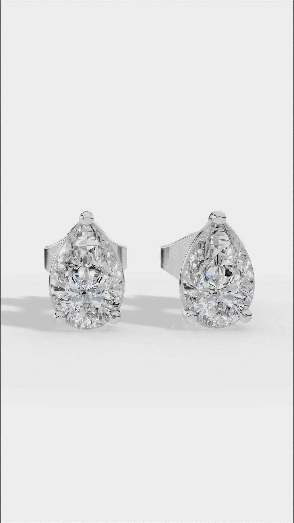 Elongated Three Prong Pear Cut Solitaire Stud Earrings