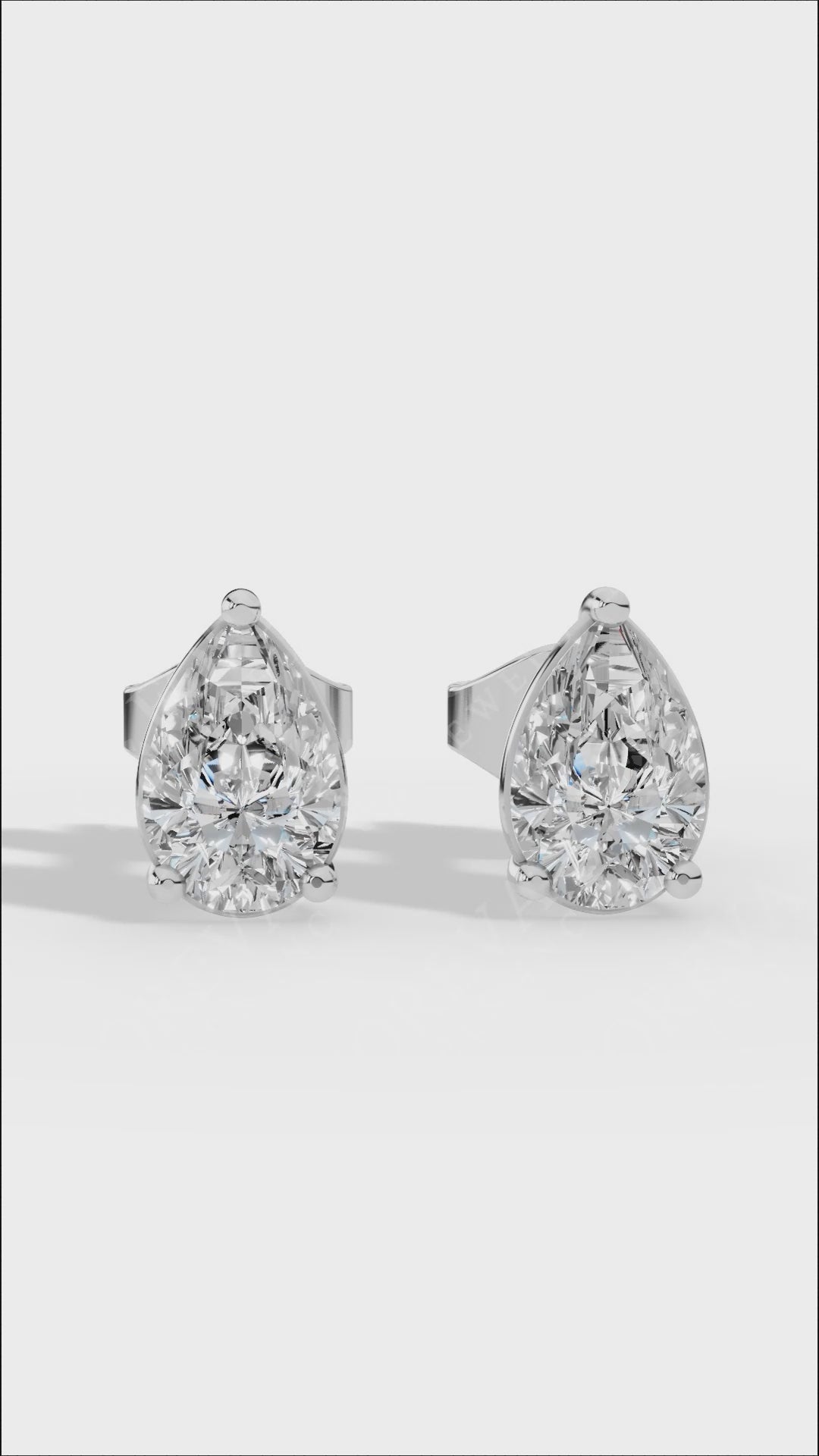 Elongated Three Prong Pear Cut Solitaire Stud Earrings