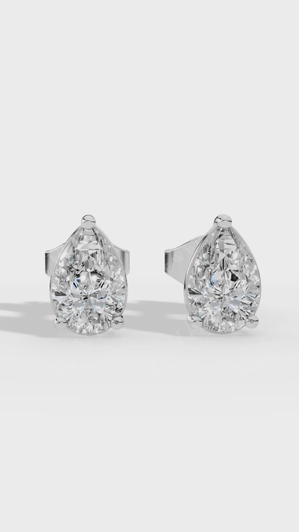 Elongated Three Prong Pear Cut Solitaire Stud Earrings 10K White Gold 0.7 CTW