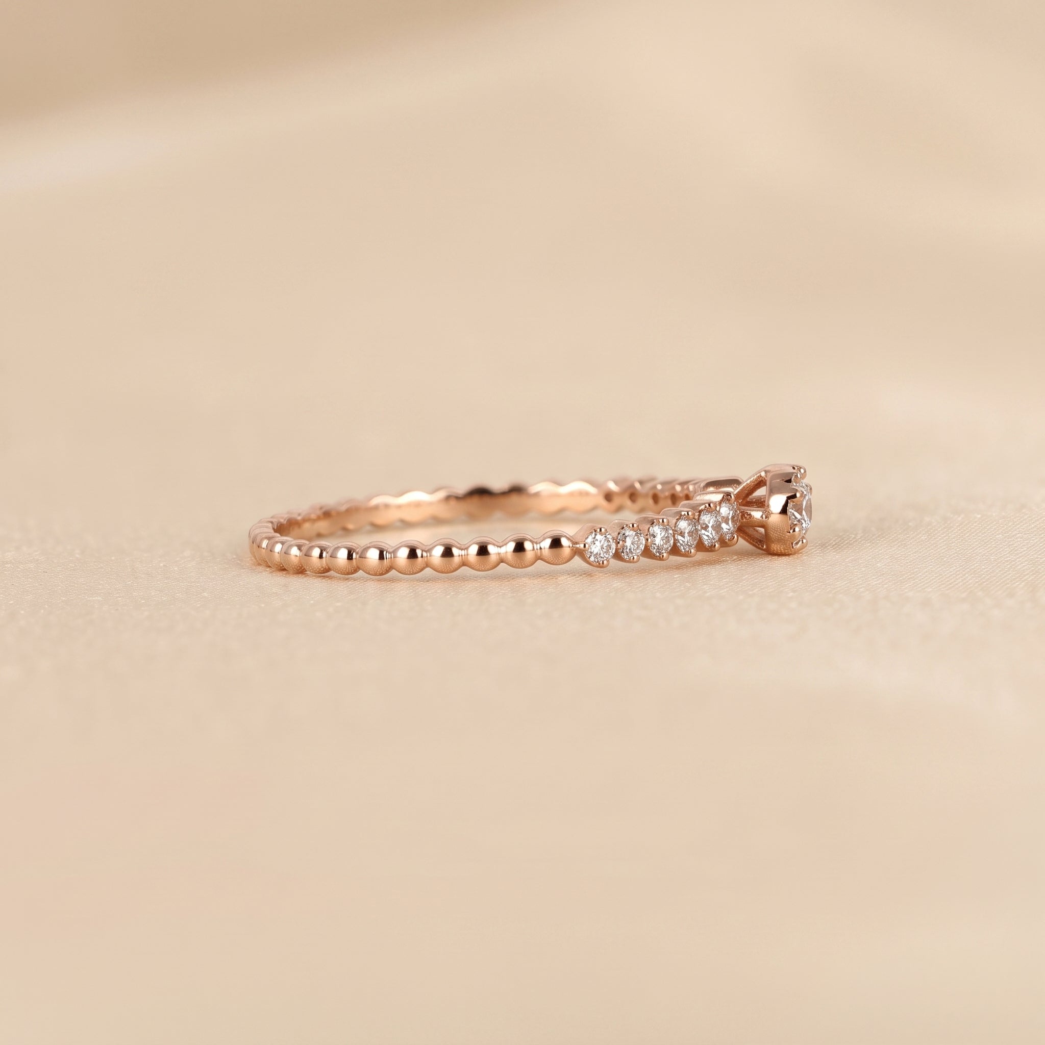 Round Cut Lab Grown Diamond Side Stone Ring in 10K Rose Gold 0.20 CTW